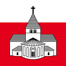 Les couleurs de la Savoie et l'église romane. Les racines profondes de la commune.